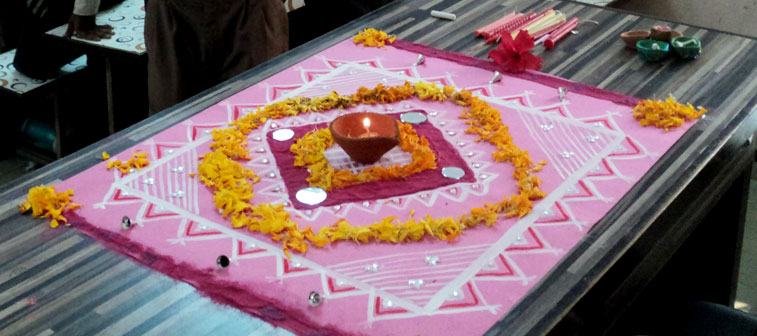 Let us talk colours here, rangoli design in pink bloom